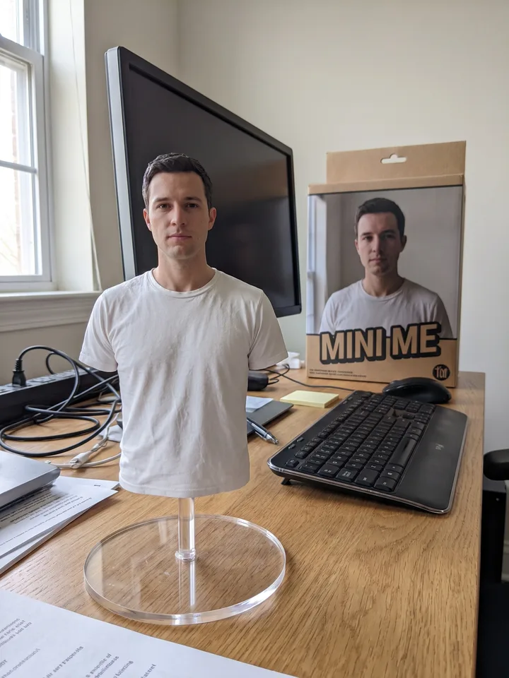 1/7 scale collectible figure of the man on a desk, next to its box