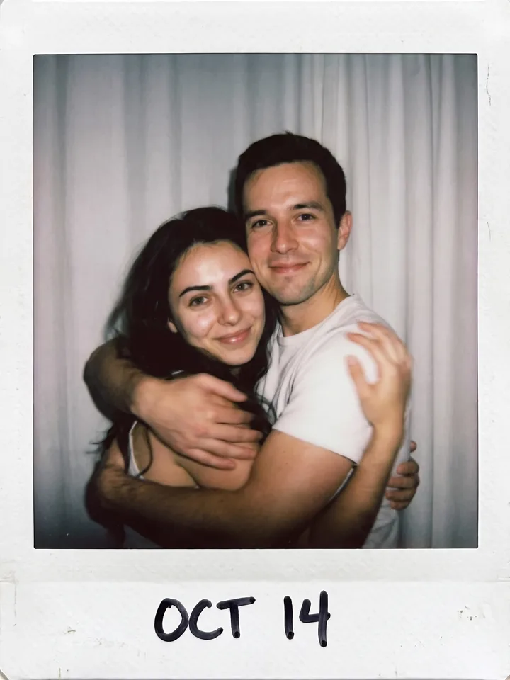 Polaroid-style snapshot of a man hugging another person, made from the male reference photo